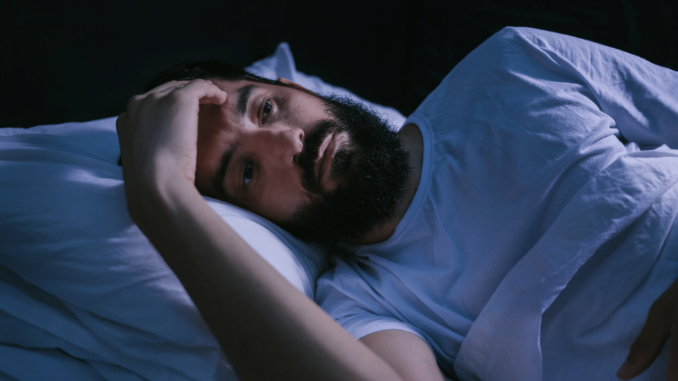 Image of man suffering from lack of sleep
