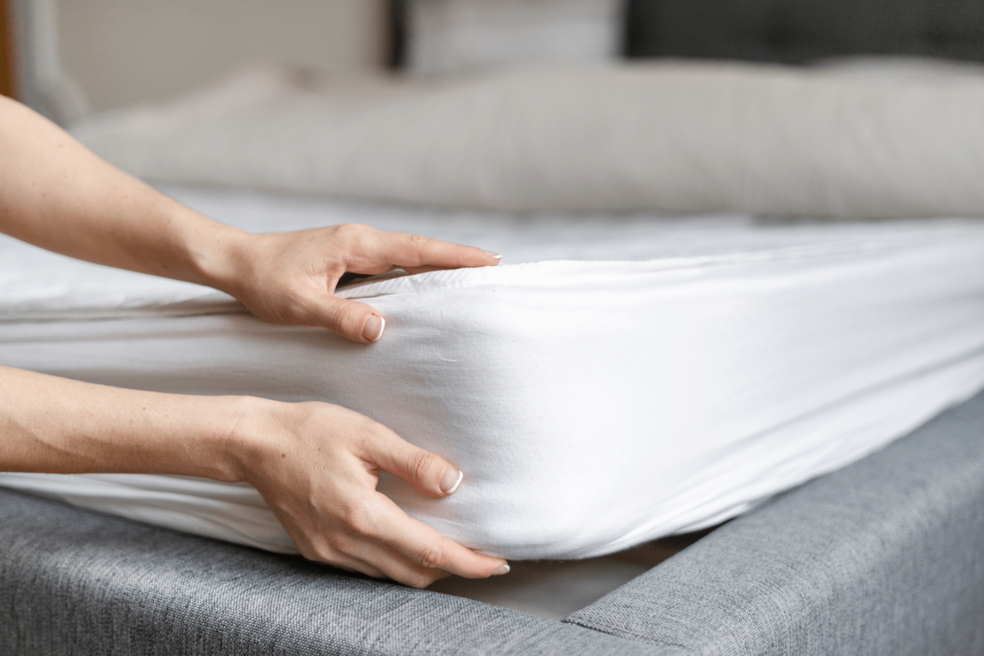 Image of mattress being placed in a bed frame